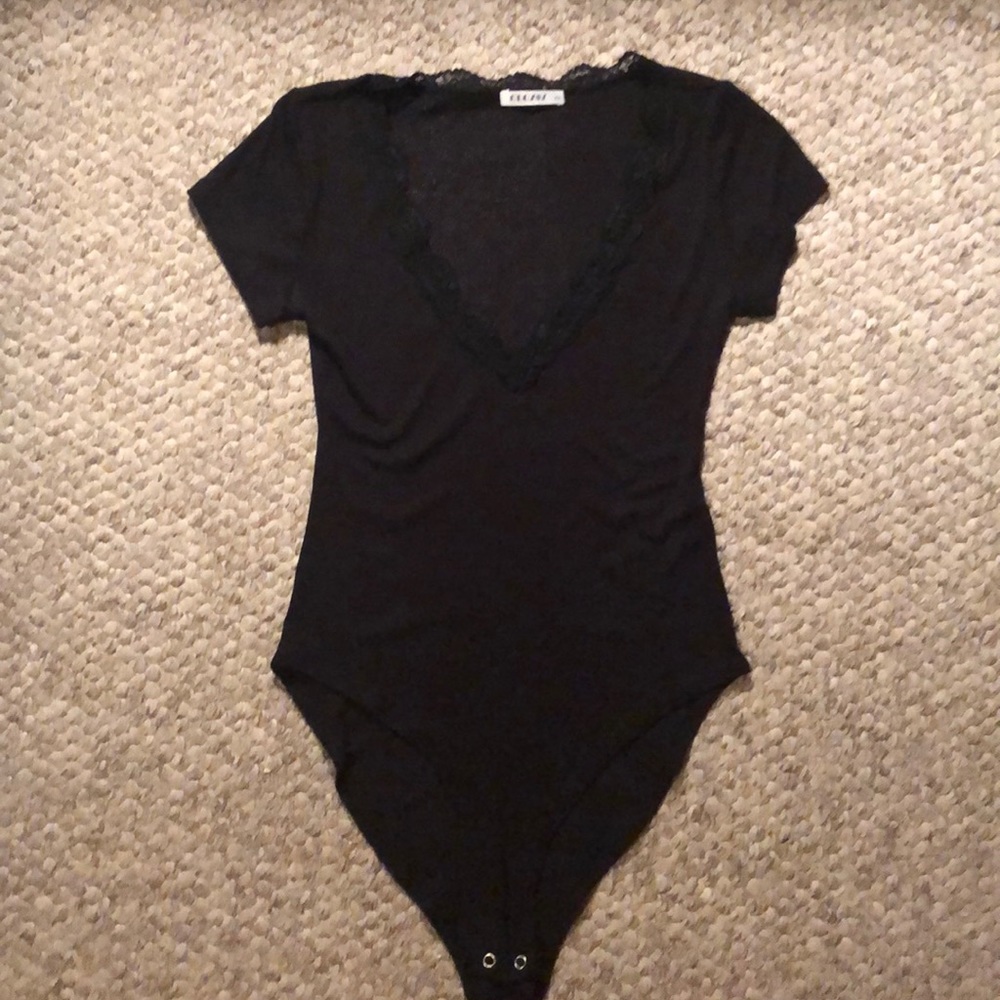 Brand new black V neck bodysuit, without tags.